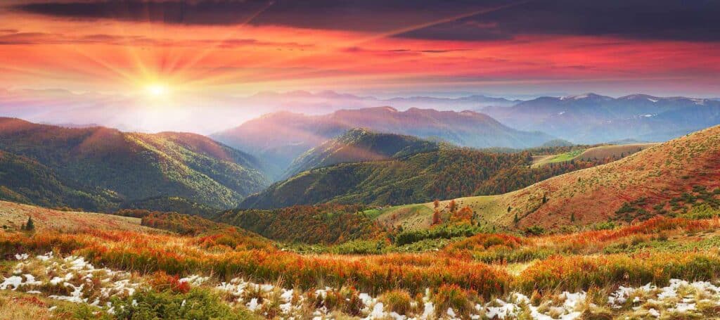 Vibrant Sierra Vista mountain landscape during sunset with colorful fall foliage and rolling hills.